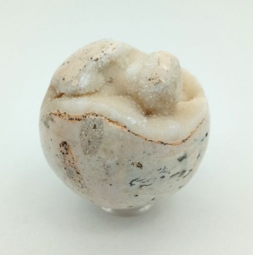 Esfera de Calcita con drusa de cristales