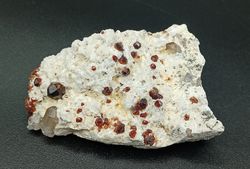 Espessartina (Granate) sobre Microclina