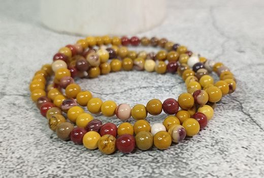 Pulseras de Mookaita bola 4mm